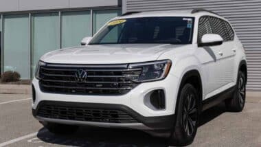 A 2024 white Volkswagen Atlas in a parking lot, representing the VW class action.