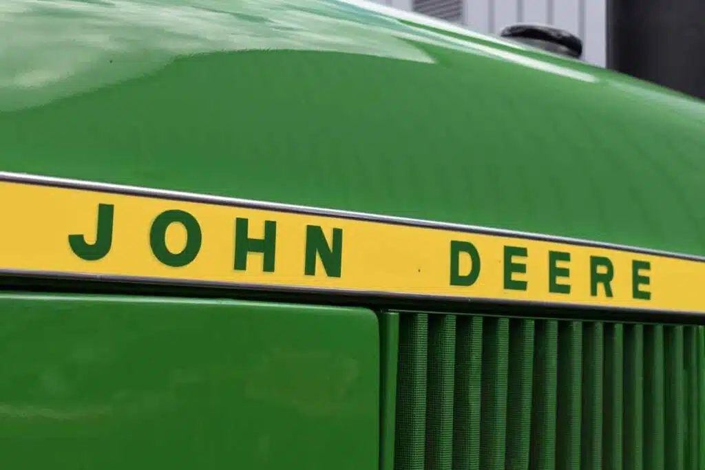 Close up of John Deere logo on a tractor, representing the John Deere class action.