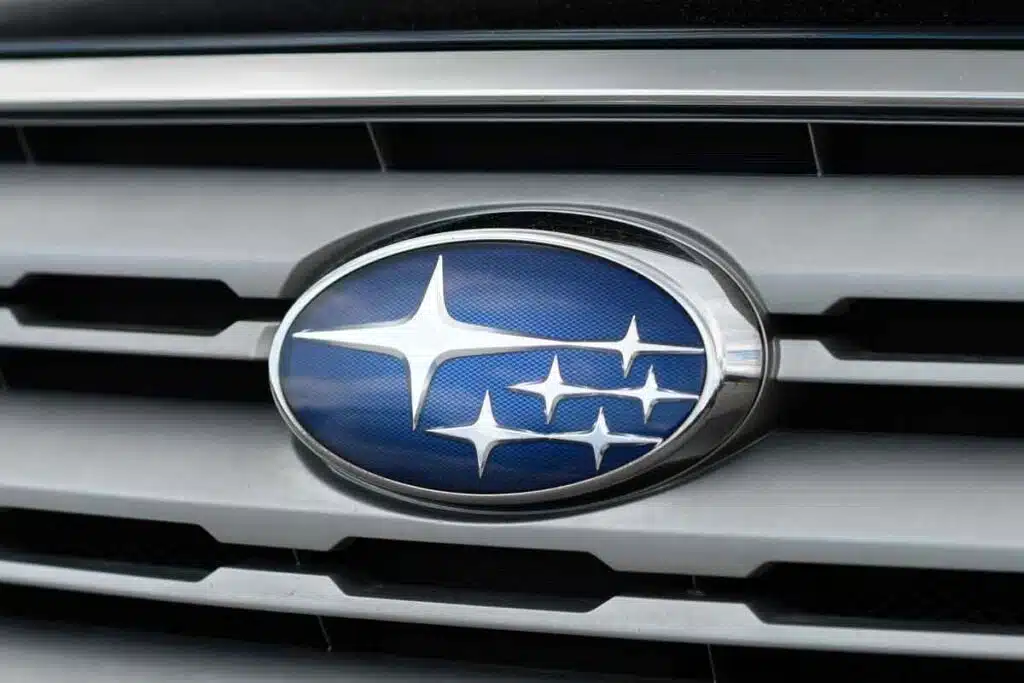 Close up of Subaru emblem on a front bumper, representing the Subaru settlement.