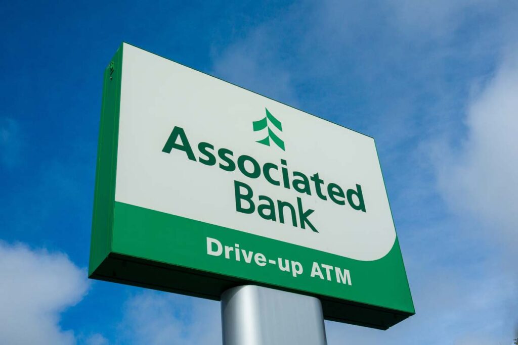 Close up of Associated Bank signage, representing the Associated Bank NSF fees investigation.