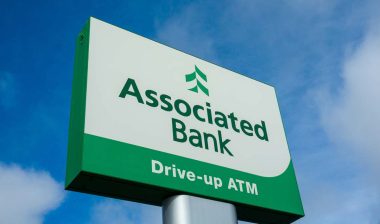 Close up of Associated Bank signage, representing the Associated Bank NSF fees investigation.