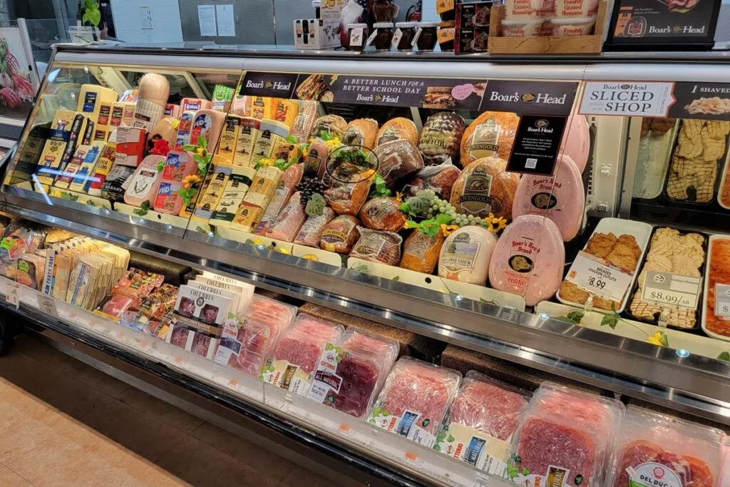 Close up of Boar's Head deli meat on display in a grocery store, representing the Boar's Head recall.