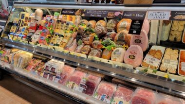 Close up of Boar's Head deli meat on display in a grocery store, representing the Boar's Head recall.