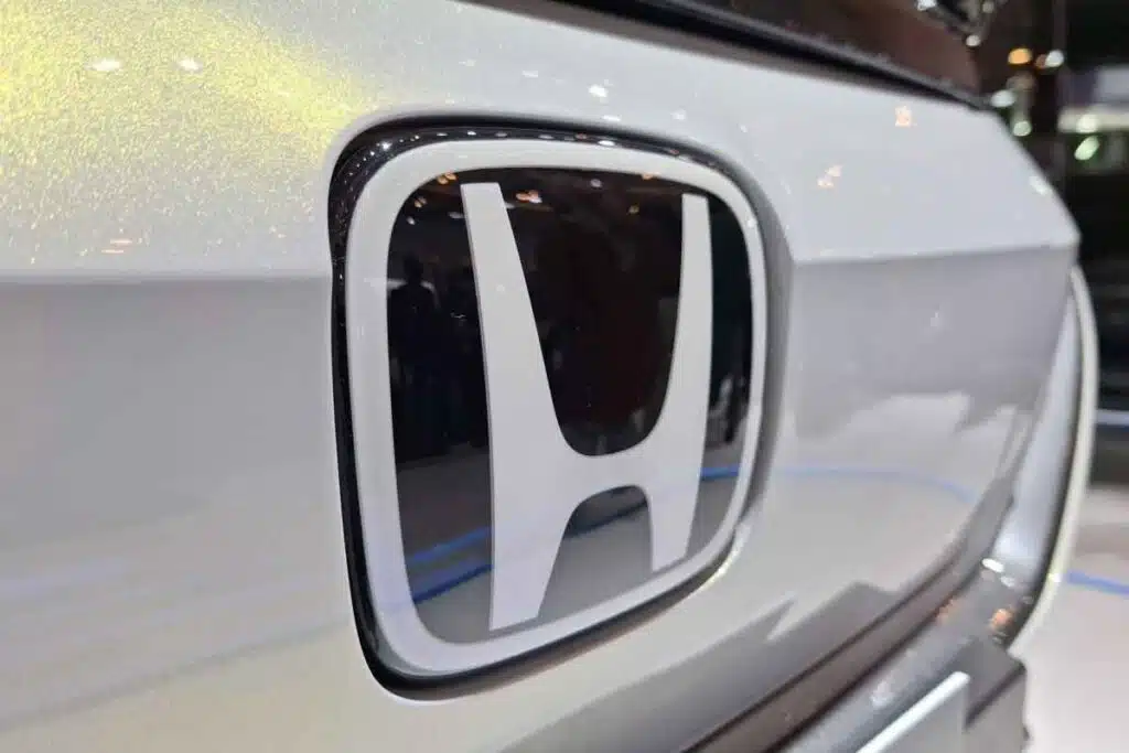 Close up of Honda emblem on a bumper, representing the Honda recall.