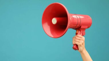 Close up of a hand holding a megaphone, representing top recalls for the week of Sept. 30.