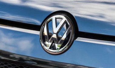 Close up of VW emblem on a front bumper, representing the VW recall.
