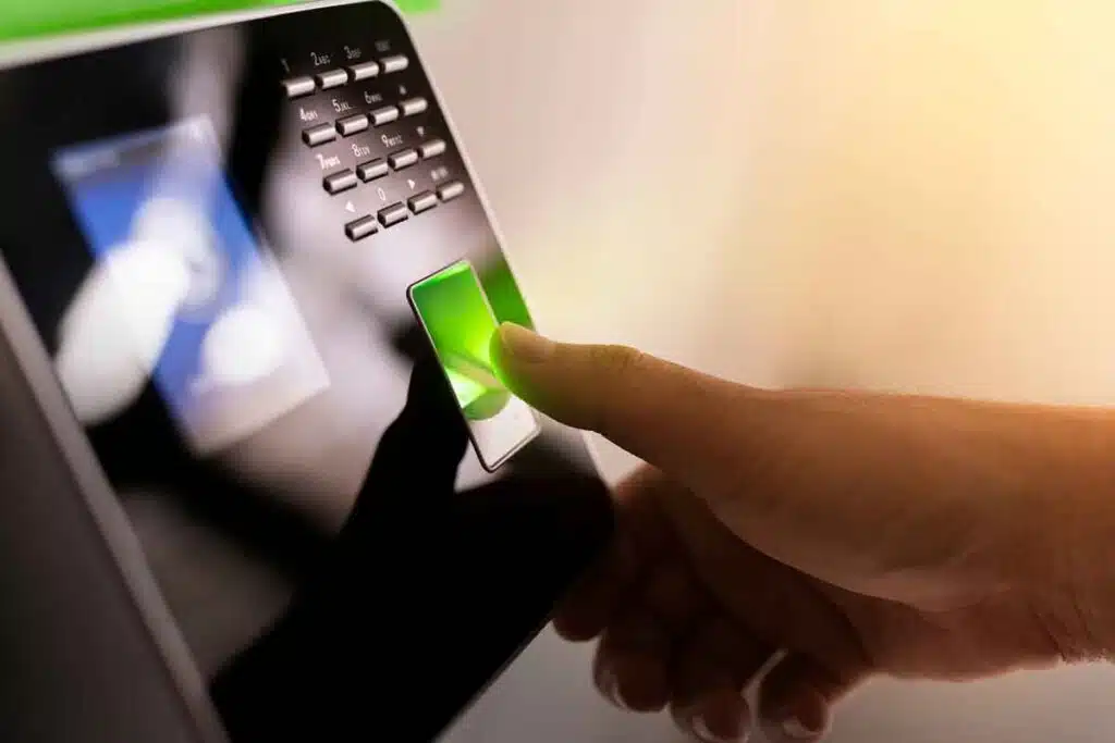 Close up of a thumb using a fingerprint time clock, representing the R.R. Donnelley & Sons and Precision Dialogue Direct settlement.