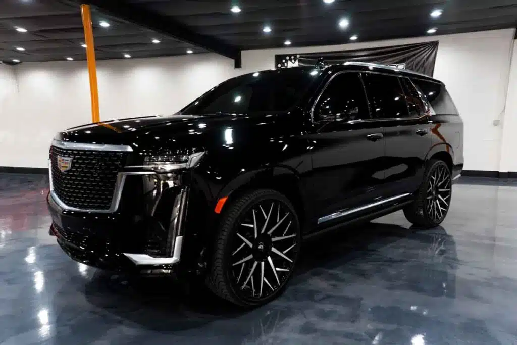 A black Escalade in a show room, representing the GM recall.