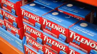 Tylenol PM products on a supermarket shelf, representing the Tylenol PM class action.