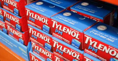 Tylenol PM products on a supermarket shelf, representing the Tylenol PM class action.
