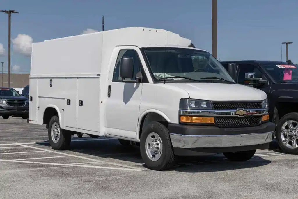A Chevrolet Express in a parking lot, representing the Chevy and GMC recall.