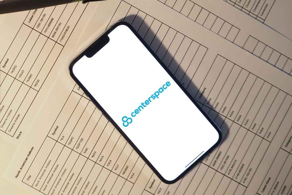 Centerspace logo displayed on a smartphone, representing the Centerspace settlement.