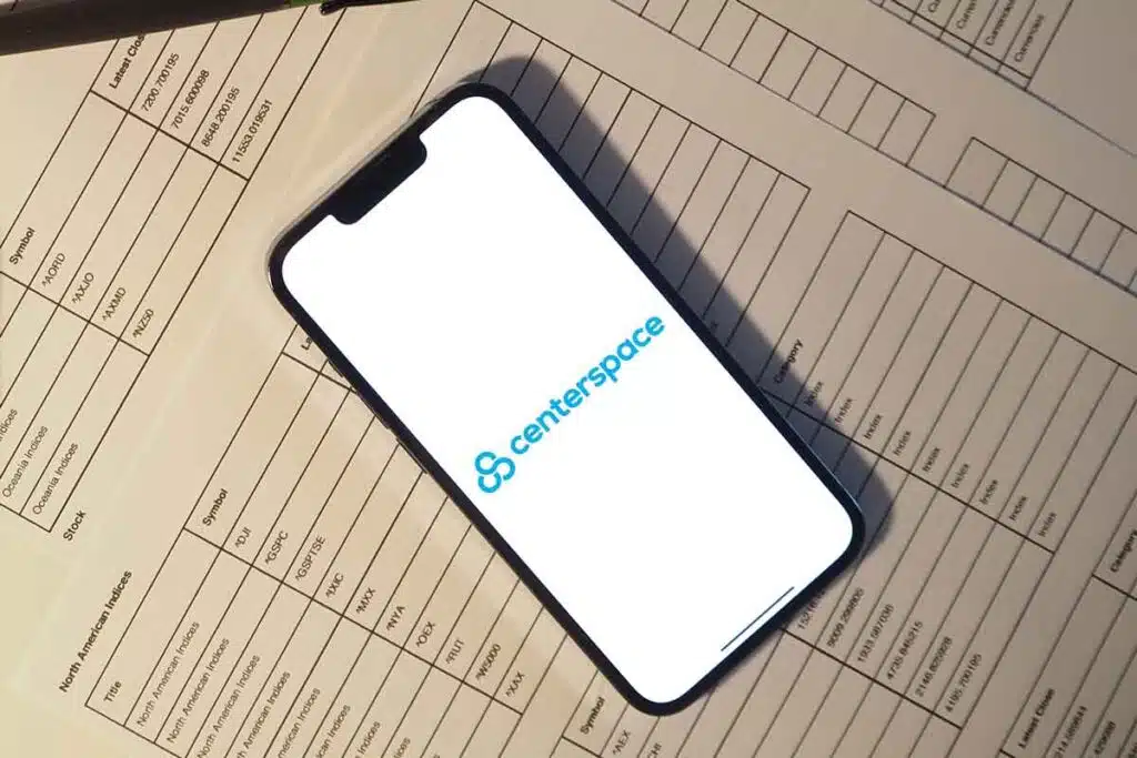 Centerspace logo displayed on a smartphone, representing the Centerspace settlement.