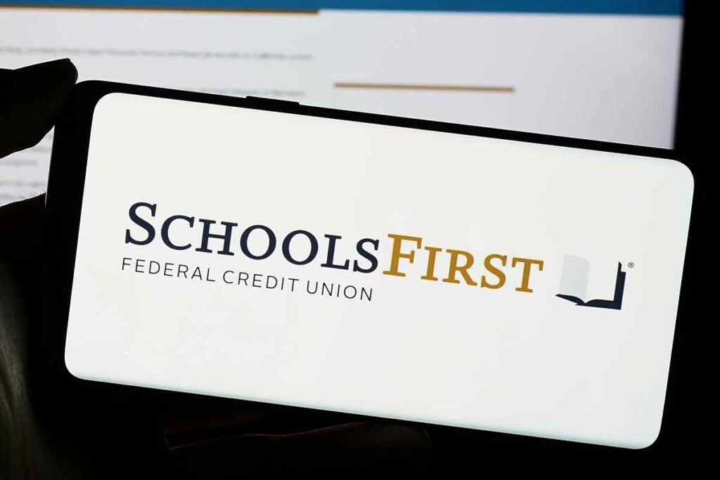 SchoolsFirst Federal Credit Union logo displayed on smartphone screen, representing SchoolsFirst Federal Credit Union NSF fees.