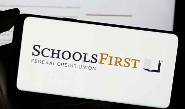 SchoolsFirst Federal Credit Union logo displayed on smartphone screen, representing SchoolsFirst Federal Credit Union NSF fees.