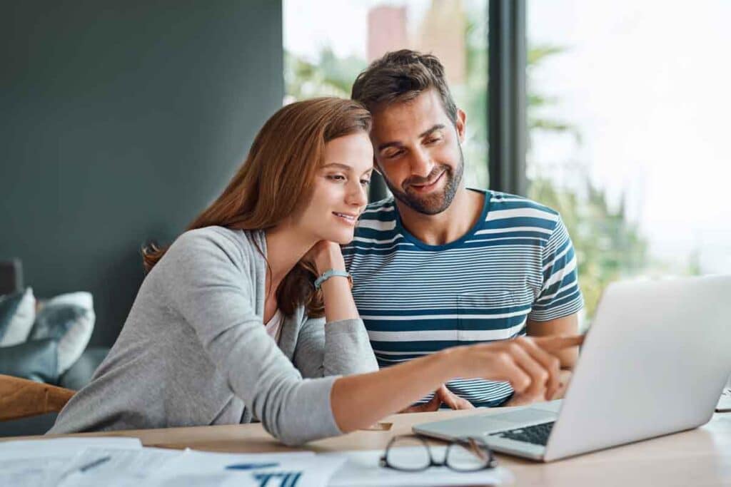 A couple looking at a computer screen, representing SelectBlinds data breach.