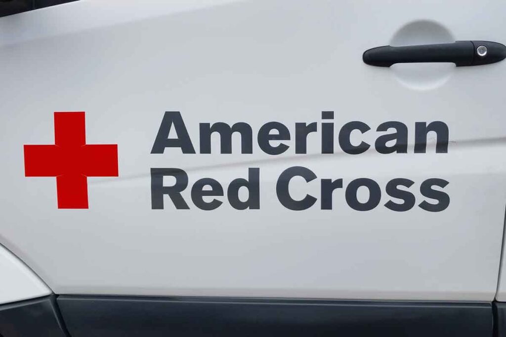 Close up of American Red Cross logo on the side of a van, representing the Red Cross class action.