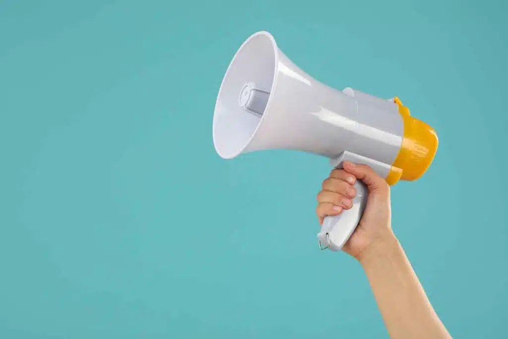 Close up of a hand holding a megaphone, representing top recalls for the week of Oct. 28.