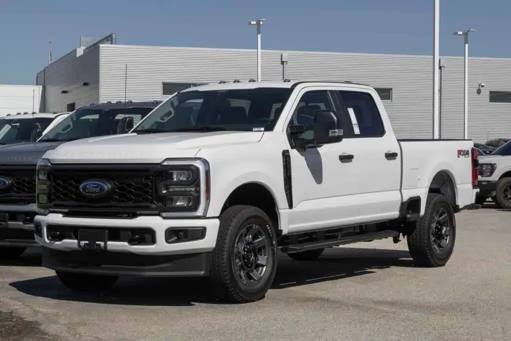 A 2024 White Ford F-250, representing the Ford recall.