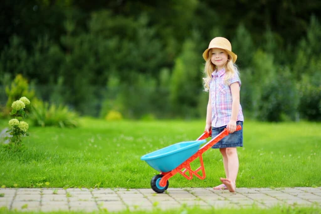 Little girl playing with toy wheel barrow representing the Red Toolbox class action.