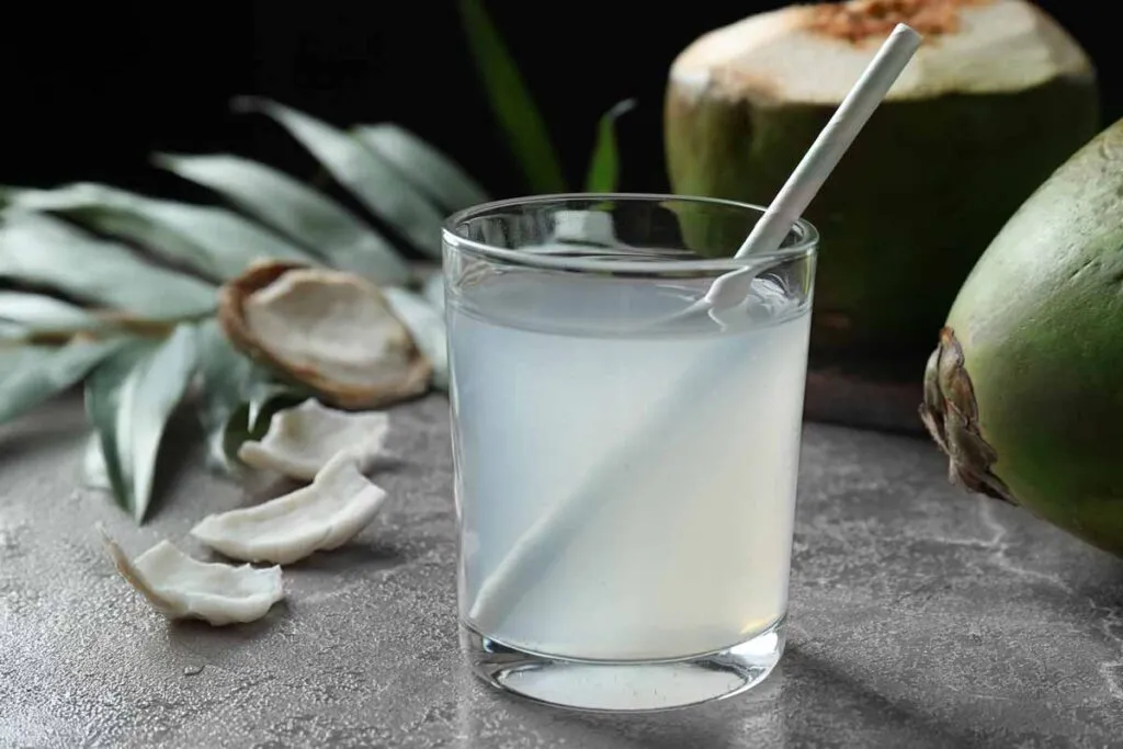 Close up of coconut water in a glass, representing the Jarritos Cocunt Water recall.