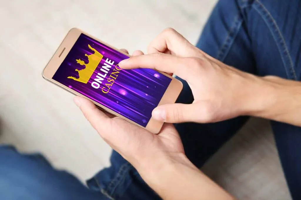 A casino app displayed on a smartphone, representing illegal gambling apps.