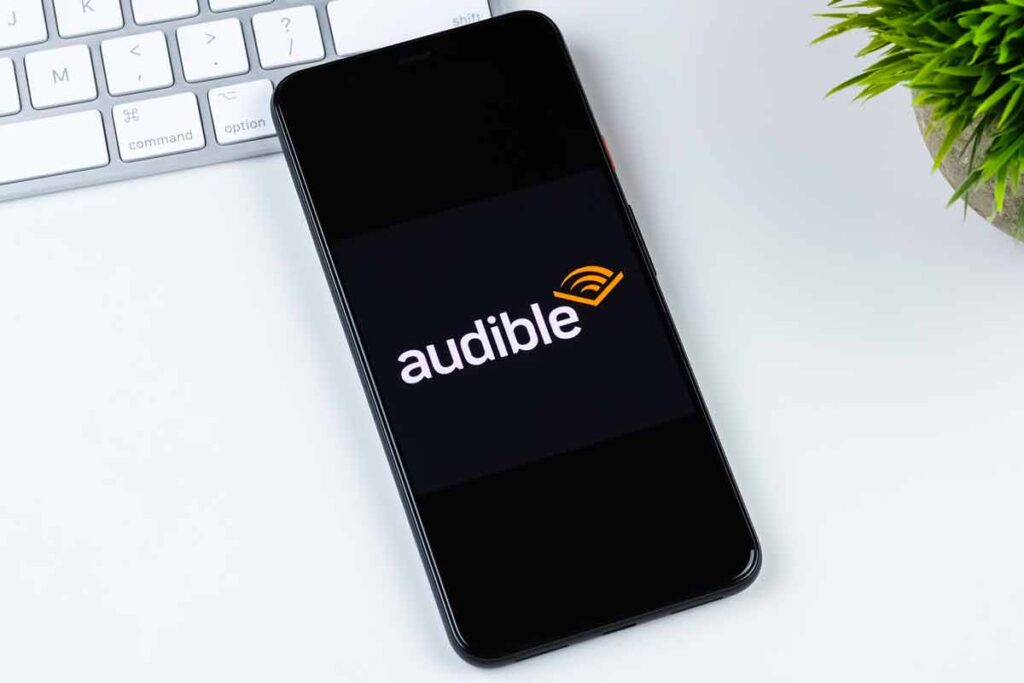 Audible logo displayed on a smartphone, representing the Audible class action.