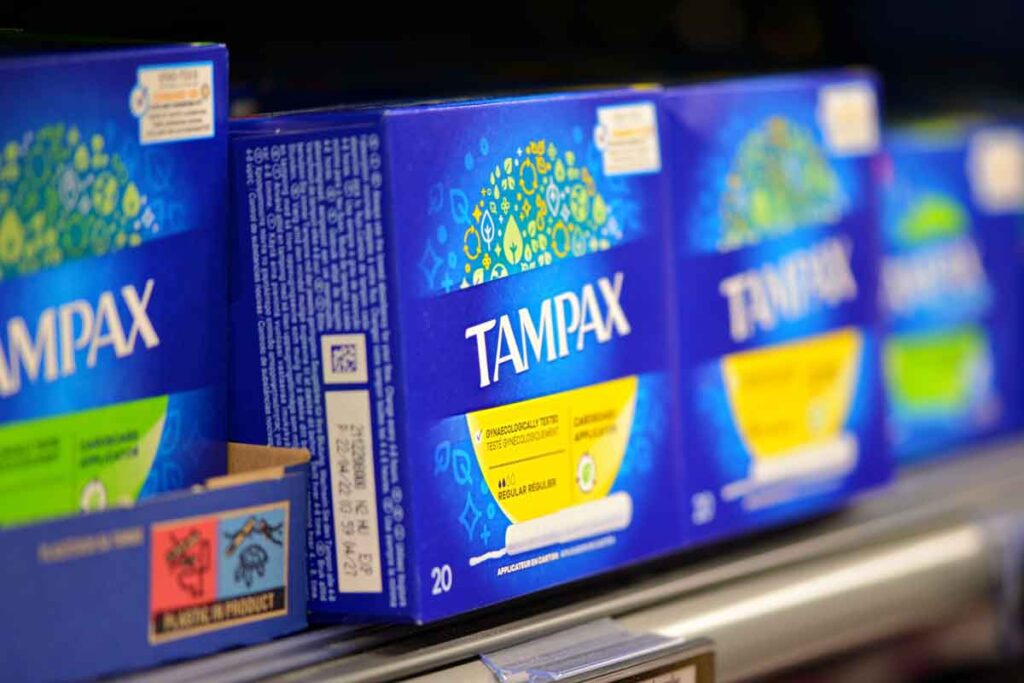 Tampax products on a supermarket shelf, representing the Tampax class action.