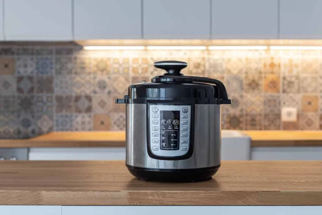 A pressure cooker on a kitchen counter, representing the Sunbeam pressure cooker verdict.