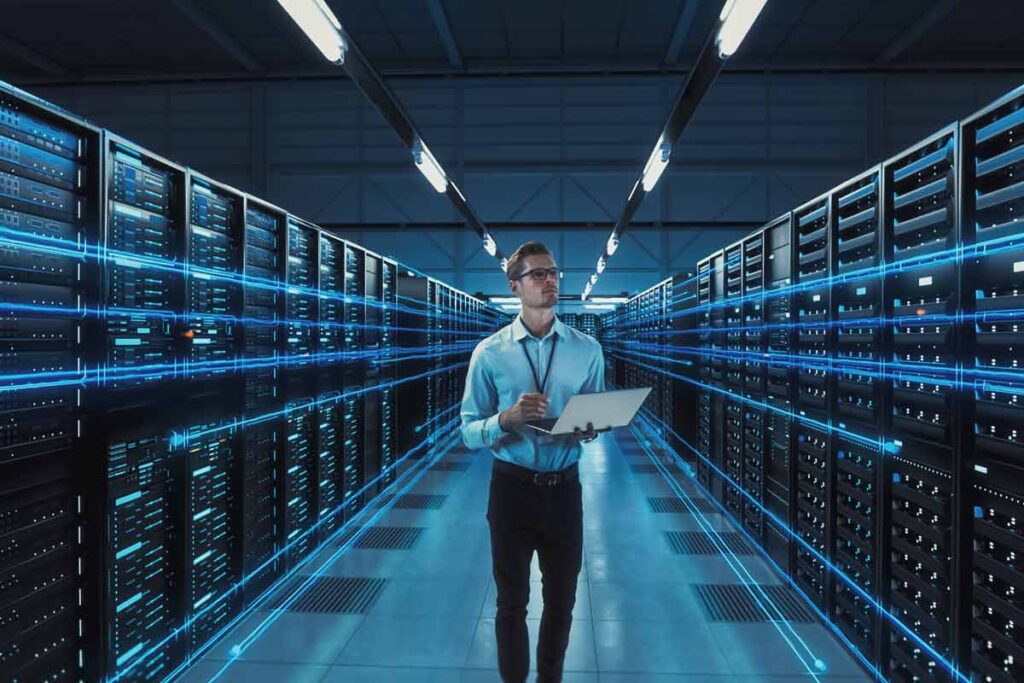 An IT worker working in a server room, representing the Kannact settlement.