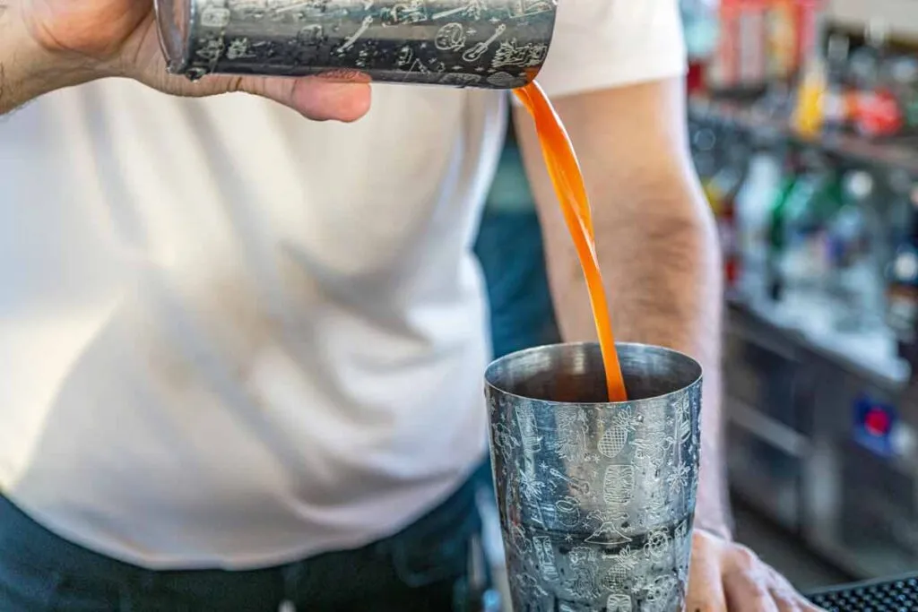 Close up of man preparing a cocktail, representing the Stirrings class action.