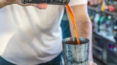 Close up of man preparing a cocktail, representing the Stirrings class action.