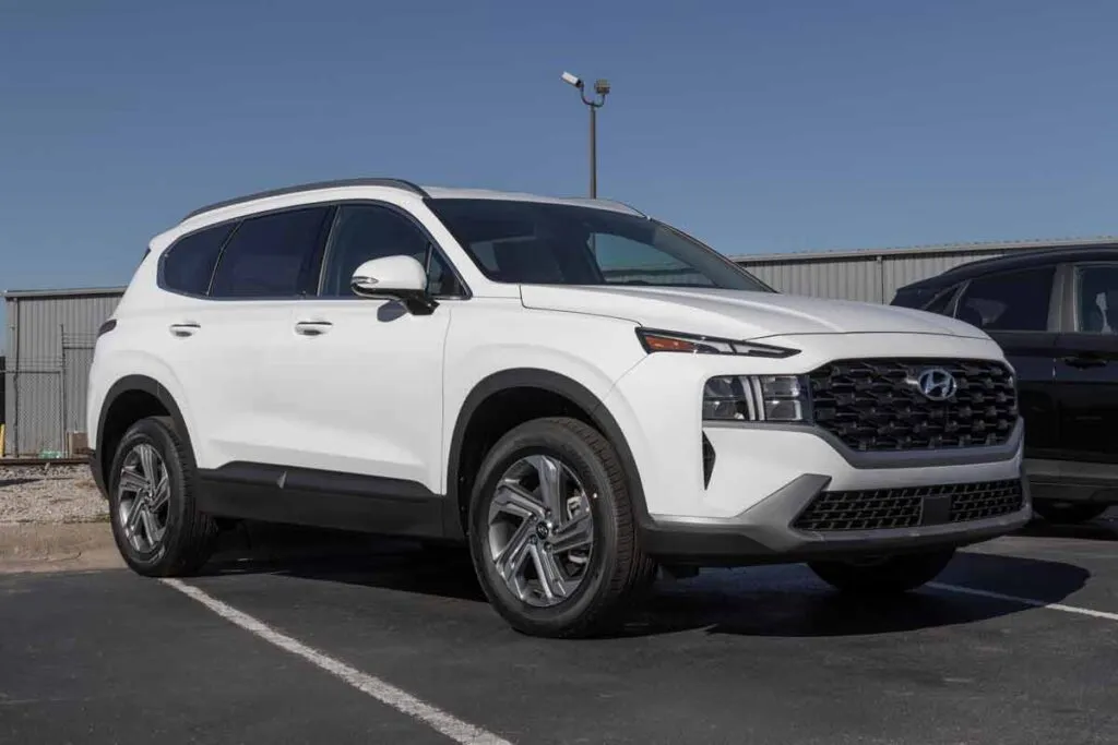 A white Hyundai Santa Fe in a parking lot, representing the Hyundai recall.