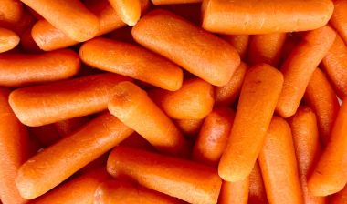 Close up of baby carrots, representing the Grimmway Farms clss action.