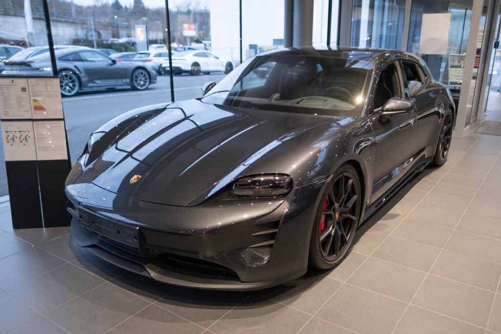 A Porsche Taycan in a showroom, representing the Porsche class action.