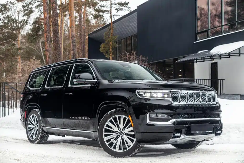 A black Grand Wagoneer parked in a driveway, representing the Jeep Grand Cherokee recall.