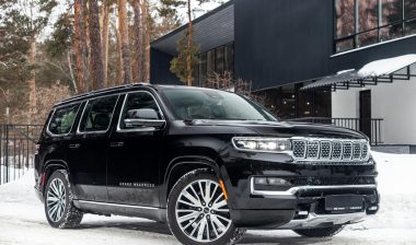 A black Grand Wagoneer parked in a driveway, representing the Jeep Grand Cherokee recall.