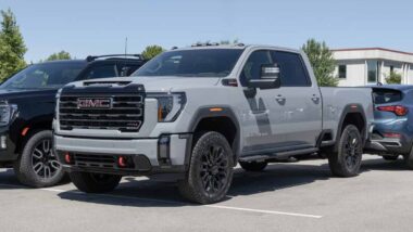 A gray GMC Sierra 2500 HD on display in a parking lot, representing the GM recall.