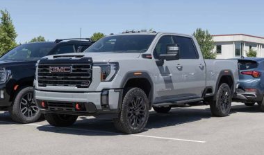 A gray GMC Sierra 2500 HD on display in a parking lot, representing the GM recall.