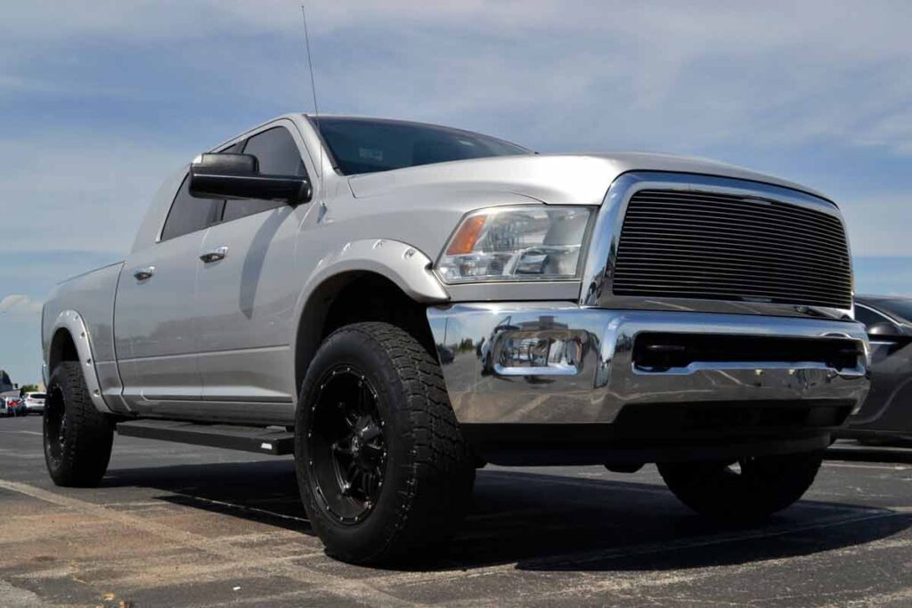 A silver Ram 2500 in a parking lot, representing the Ram recall.
