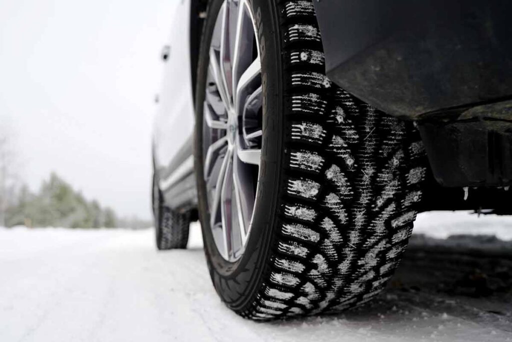 Close up of a car tire in the snow, representing the snow tire recall.