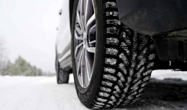 Close up of a car tire in the snow, representing the snow tire recall.
