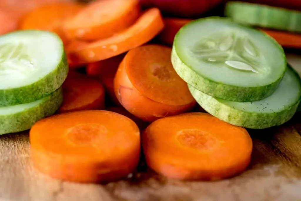 Close up of sliced cucumbers and carrots, representing the vegetable recalls.