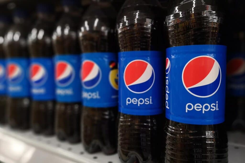 Close up of Pepsi bottles on display at a supermarket, representing the Pepsi lawsuit.