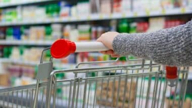 Close up of a woman pushing a shopping cart, representing false advertising.