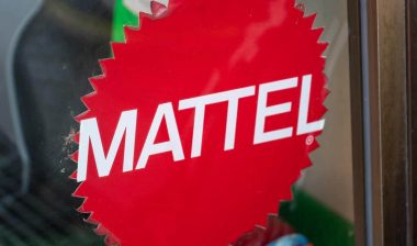 Close up of Mattel logo signage on a glass window, representing the Mattel class action.