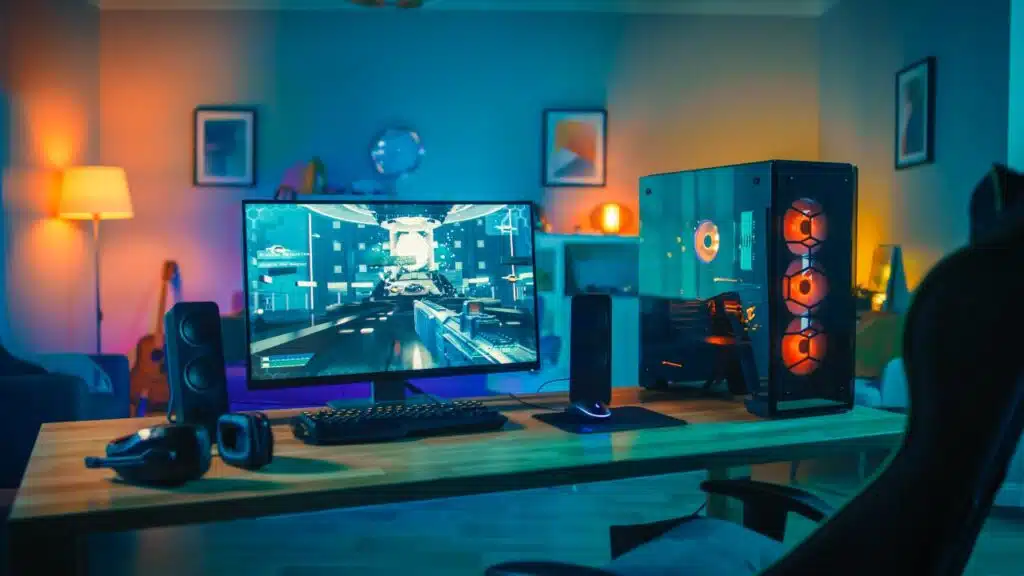 Powerful Personal Computer Gamer Rig with First-Person Shooter Game on Screen.