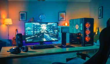 Powerful Personal Computer Gamer Rig with First-Person Shooter Game on Screen.
