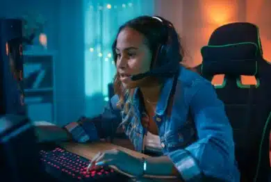 Girl playing video games on PC.