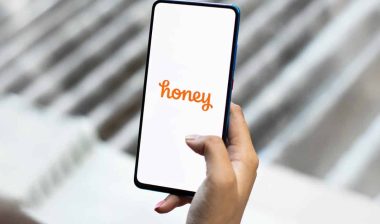 Honey logo displayed on a smartphone screen, representing the PayPal honey web extension class action lawsuit.